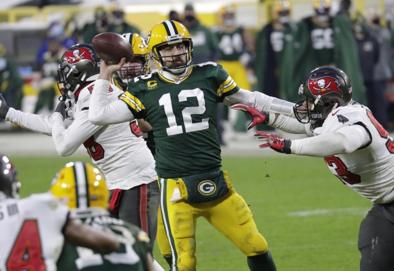 Jan 24, 2021, Green Bay, WI, USA; Green Bay Packers quarterback Aaron Rodgers (12) throws an inccomplete pass against Tampa Bay Buccaneers defensive end Ndamukong Suh (93) in the final minutes of the game during the NFC championship game Sunday, January 24, 2021, at Lambeau Field Mandatory credit: Dan Powers / Milwaukee Journal Sentinel via USA TODAY NETWORK