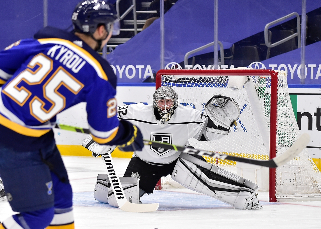 Jan 24, 2021; St. Louis, Missouri, USA;  Los Angeles Kings goaltender Jonathan Quick (32) defends the net against St. Louis Blues center Jordan Kyrou (25) during the first period at Enterprise Center. Mandatory Credit: Jeff Curry-USA TODAY Sports