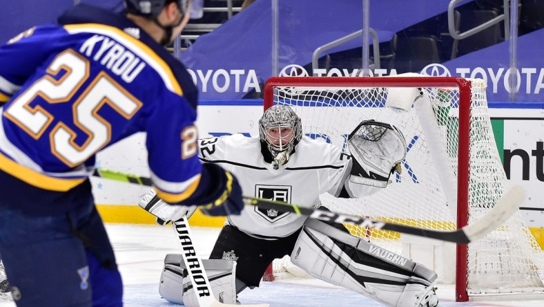 Jan 24, 2021; St. Louis, Missouri, USA;  Los Angeles Kings goaltender Jonathan Quick (32) defends the net against St. Louis Blues center Jordan Kyrou (25) during the first period at Enterprise Center. Mandatory Credit: Jeff Curry-USA TODAY Sports