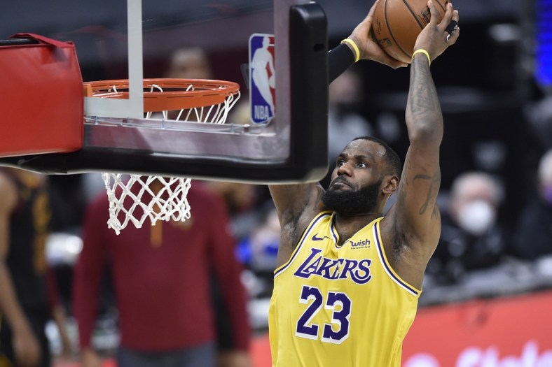 Jan 25, 2021; Cleveland, Ohio, USA; Los Angeles Lakers forward LeBron James (23) dunks in the fourth quarter against the Cleveland Cavaliers at Rocket Mortgage FieldHouse. Mandatory Credit: David Richard-USA TODAY Sports