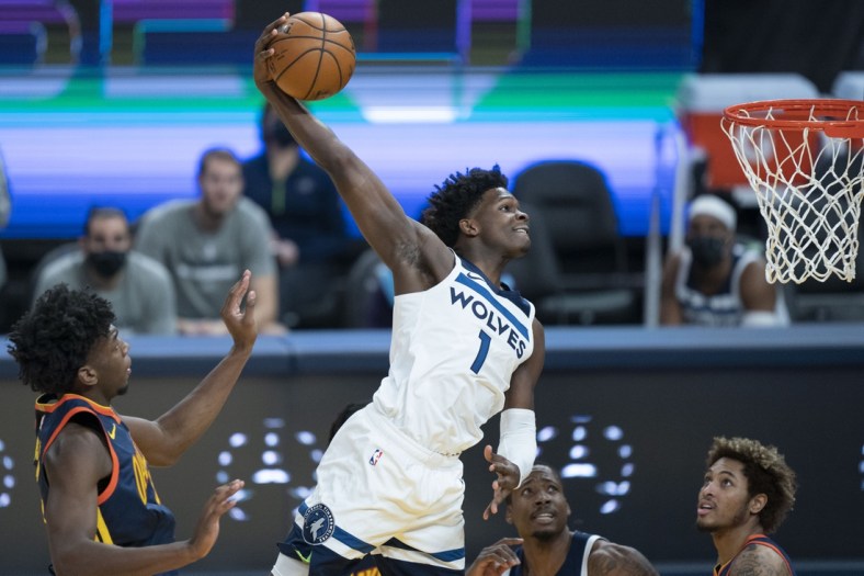 January 25, 2021; San Francisco, California, USA; Minnesota Timberwolves guard Anthony Edwards (1) dunks the basketball against Golden State Warriors center James Wiseman (33) during the first quarter at Chase Center. Mandatory Credit: Kyle Terada-USA TODAY Sports