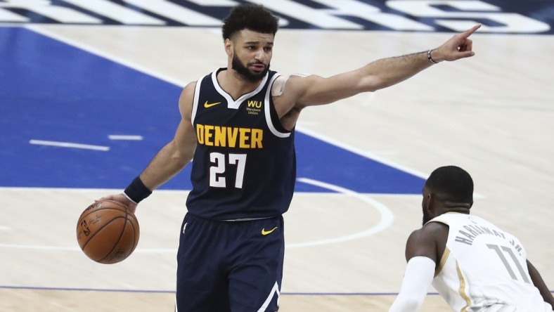 Jan 25, 2021; Dallas, Texas, USA; Denver Nuggets guard Jamal Murray (27) calls out a play as Dallas Mavericks forward Tim Hardaway Jr. (11) defends during the second half at American Airlines Center. Mandatory Credit: Kevin Jairaj-USA TODAY Sports