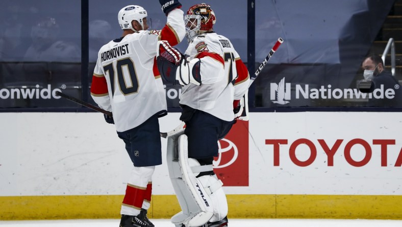 Jan 26, 2021; Columbus, Ohio, USA; Florida Panthers right wing Patric Hornqvist (70) celebrates with goaltender Sergei Bobrovsky (72) after defeating the Columbus Blue Jackets in a shootout at Nationwide Arena. Mandatory Credit: Aaron Doster-USA TODAY Sports