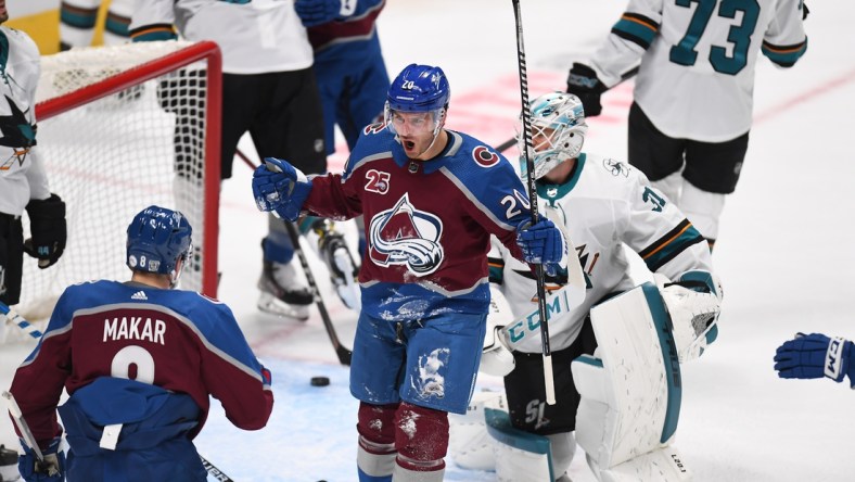 Jan 26, 2021; Denver, Colorado, USA; Colorado Avalanche left wing Brandon Saad (20) celebrates with defenseman Cale Makar (8)  after scoring a goal against the San Jose Sharks in the first period at Ball Arena. Mandatory Credit: Ron Chenoy-USA TODAY Sports