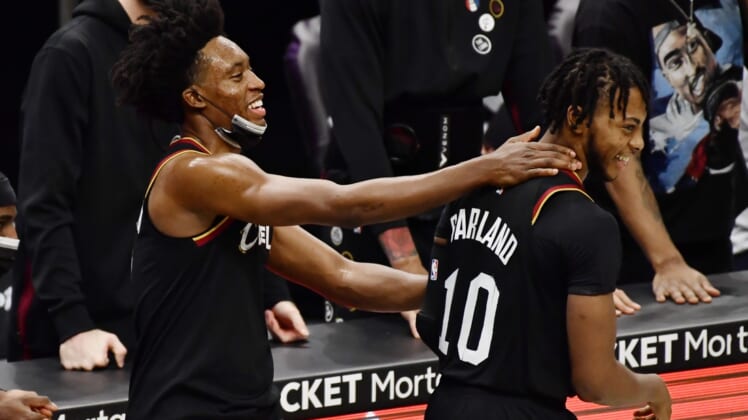 Jan 27, 2021; Cleveland, Ohio, USA; Cleveland Cavaliers guard Collin Sexton (2) and guard Darius Garland (10) celebrate during the fourth quarter against the Detroit Pistons at Rocket Mortgage FieldHouse. Mandatory Credit: Ken Blaze-USA TODAY Sports