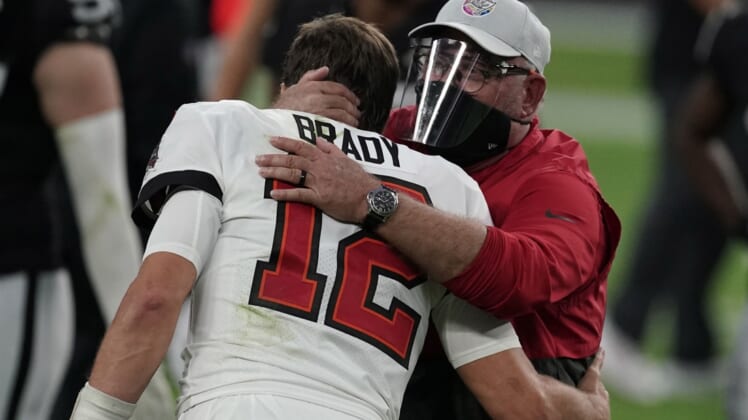 Oct 25, 2020; Paradise, Nevada, USA; Tampa Bay Buccaneers quarterback Tom Brady (12) and coach Bruce Arians embrace after the game against the Las Vegas Raiders at Allegiant Stadium. The Buccaneers defeated the Raiders 45-20. Mandatory Credit: Kirby Lee-USA TODAY Sports