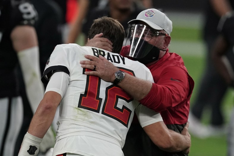Oct 25, 2020; Paradise, Nevada, USA; Tampa Bay Buccaneers quarterback Tom Brady (12) and coach Bruce Arians embrace after the game against the Las Vegas Raiders at Allegiant Stadium. The Buccaneers defeated the Raiders 45-20. Mandatory Credit: Kirby Lee-USA TODAY Sports