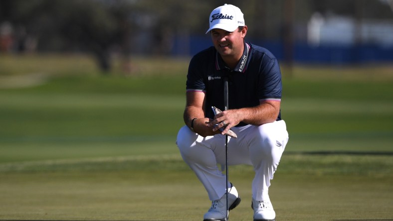 Jan 28, 2021; San Diego, California, USA; Patrick Reed lines up a putt on the 11th green during the first round of the Farmers Insurance Open golf tournament at Torrey Pines Municipal Golf North Course. Mandatory Credit: Orlando Ramirez-USA TODAY Sports