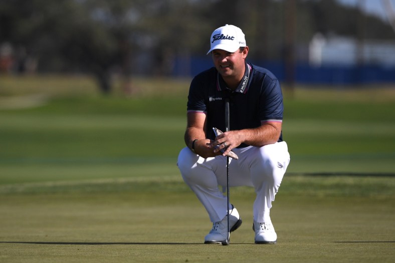 Jan 28, 2021; San Diego, California, USA; Patrick Reed lines up a putt on the 11th green during the first round of the Farmers Insurance Open golf tournament at Torrey Pines Municipal Golf North Course. Mandatory Credit: Orlando Ramirez-USA TODAY Sports