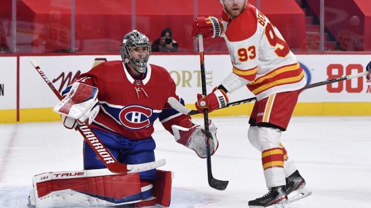 Jan 28, 2021; Montreal, Quebec, CAN; Calgary Flames forward Sam Bennett (93) screens Montreal Canadiens goalie Carey Price (31) during the third period at the Bell Centre. Mandatory Credit: Eric Bolte-USA TODAY Sports