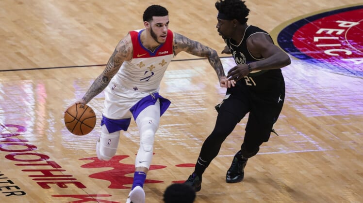 Jan 29, 2021; New Orleans, Louisiana, USA;  New Orleans Pelicans guard Lonzo Ball (2) drives against Milwaukee Bucks guard Jrue Holiday (21) during the second quarter at the Smoothie King Center. Mandatory Credit: Derick E. Hingle-USA TODAY Sports
