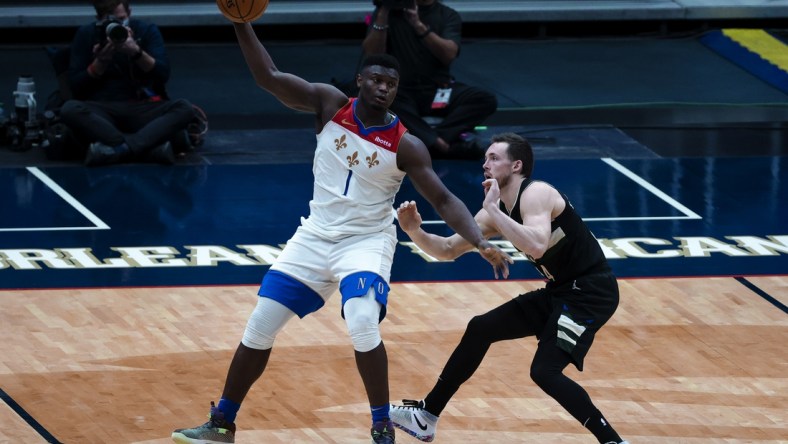 Jan 29, 2021; New Orleans, Louisiana, USA;  New Orleans Pelicans forward Zion Williamson (1) is defended by Milwaukee Bucks guard Pat Connaughton (24) during the fourth quarter at the Smoothie King Center. Mandatory Credit: Derick E. Hingle-USA TODAY Sports