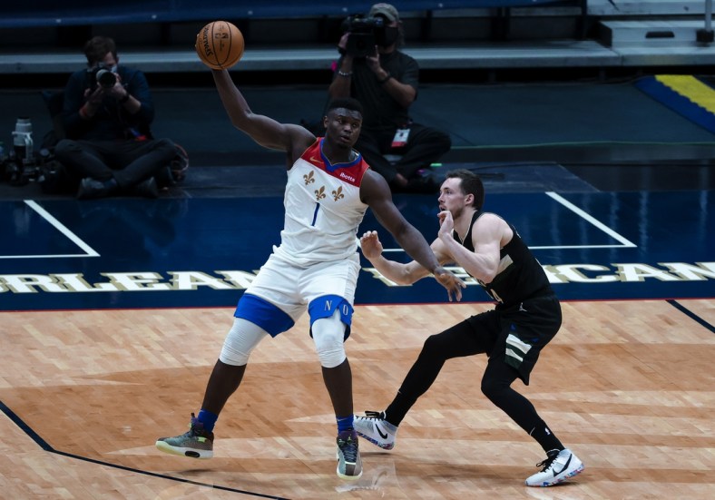 Jan 29, 2021; New Orleans, Louisiana, USA;  New Orleans Pelicans forward Zion Williamson (1) is defended by Milwaukee Bucks guard Pat Connaughton (24) during the fourth quarter at the Smoothie King Center. Mandatory Credit: Derick E. Hingle-USA TODAY Sports