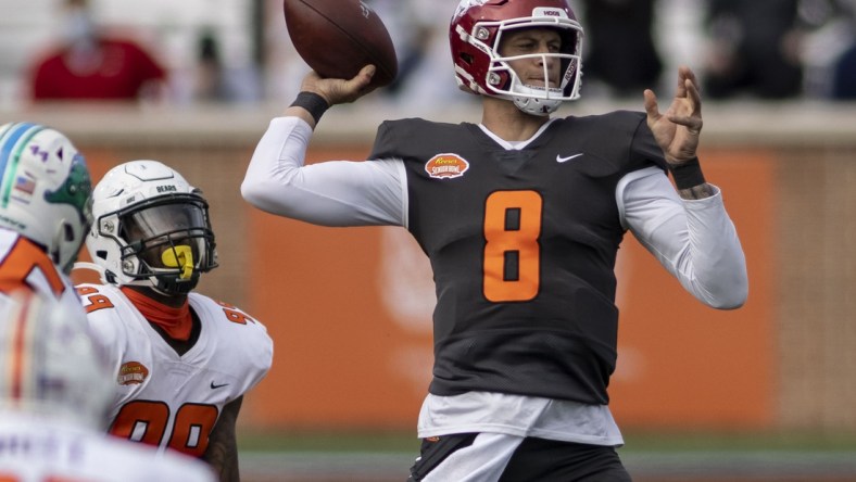 Jan 30, 2021; Mobile, AL, USA; National quarterback Feleipe Franks of Arkansas (8) throws in the first half of the 2021 Senior Bowl at Hancock Whitney Stadium. Mandatory Credit: Vasha Hunt-USA TODAY Sports