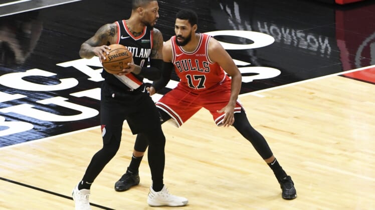 Jan 30, 2021; Chicago, Illinois, USA; Portland Trail Blazers guard Damian Lillard (0) is defended by Chicago Bulls guard Garrett Temple (17) during the first half at United Center. Mandatory Credit: David Banks-USA TODAY Sports