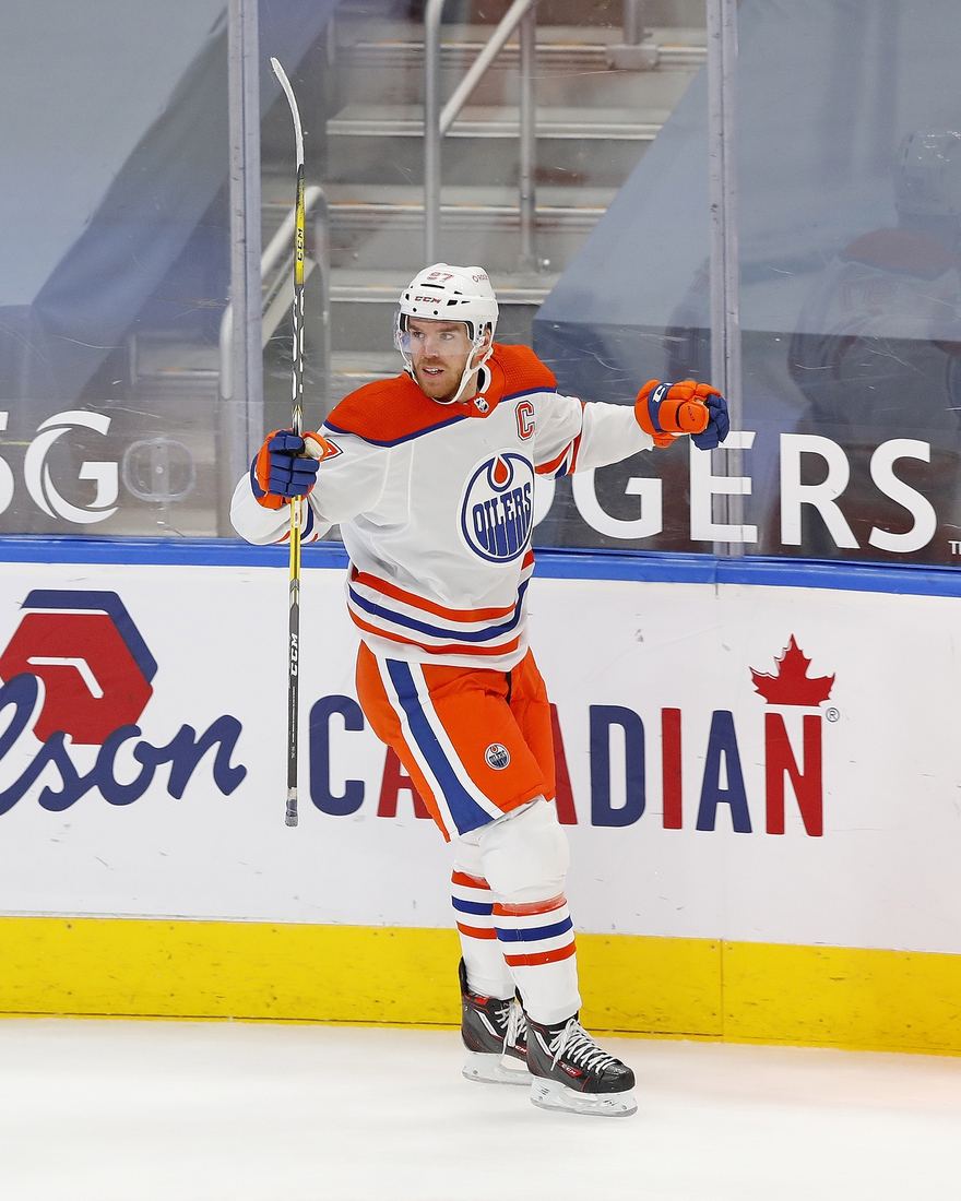 Jan 30, 2021; Edmonton, Alberta, CAN; Edmonton Oilers forward Connor McDavid (97) celebrates his overtime winning goal against the Toronto Maple Leafs at Rogers Place. Mandatory Credit: Perry Nelson-USA TODAY Sports