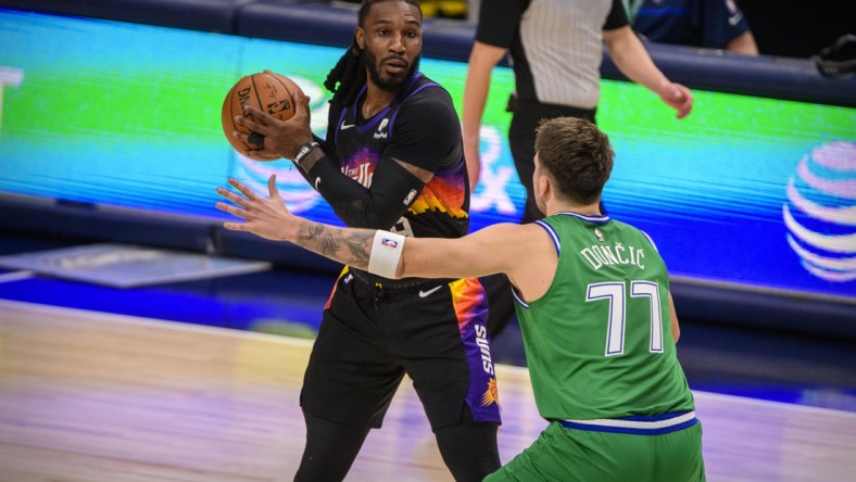 Jan 30, 2021; Dallas, Texas, USA; Dallas Mavericks guard Luka Doncic (77) guards Phoenix Suns forward Jae Crowder (99) during the second quarter at the American Airlines Center. Mandatory Credit: Jerome Miron-USA TODAY Sports