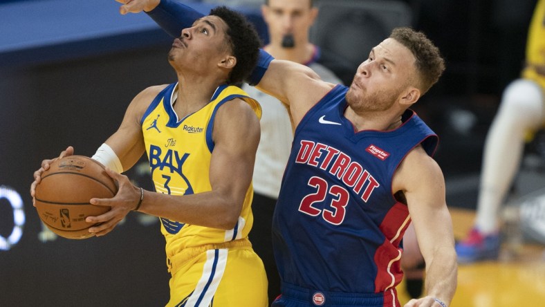 January 30, 2021; San Francisco, California, USA; Golden State Warriors guard Jordan Poole (3) shoots the basketball against Detroit Pistons forward Blake Griffin (23) during the second quarter at Chase Center. Mandatory Credit: Kyle Terada-USA TODAY Sports