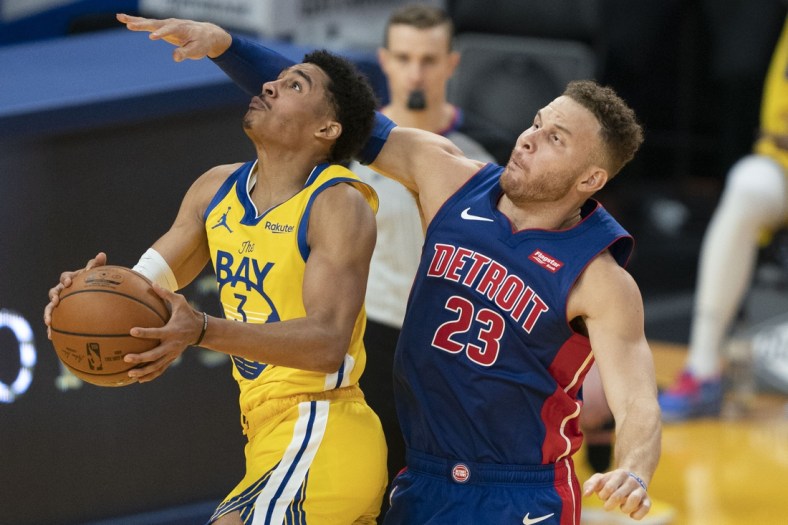 January 30, 2021; San Francisco, California, USA; Golden State Warriors guard Jordan Poole (3) shoots the basketball against Detroit Pistons forward Blake Griffin (23) during the second quarter at Chase Center. Mandatory Credit: Kyle Terada-USA TODAY Sports