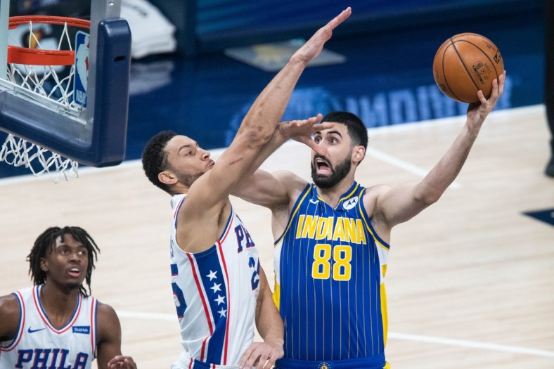 Jan 31, 2021; Indianapolis, Indiana, USA; Indiana Pacers center Goga Bitadze (88) shoots the ball while Philadelphia 76ers guard Ben Simmons (25) defends  in the second quarter at Bankers Life Fieldhouse. Mandatory Credit: Trevor Ruszkowski-USA TODAY Sports