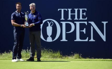 Jul 17, 2017; Southport, ENG; Henrik Stenson (SWE) pose with the Claret Jug and Martin Slumbers, Chief Executive of the R&A during a practice round of The 146th Open Championship golf tournament at Royal Birkdale Golf Club. Mandatory Credit: Thomas J. Russo-USA TODAY Sports