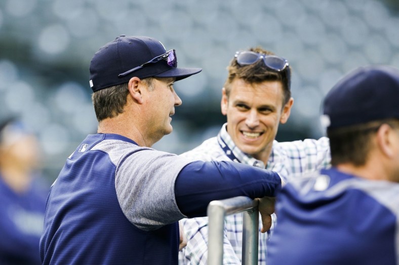 May 3, 2018; Seattle, WA, USA; Seattle Mariners manager Scott Servais (29) talks with general manager Jerry Dipoto during batting practice against the Oakland Athletics at Safeco Field. Mandatory Credit: Joe Nicholson-USA TODAY Sports