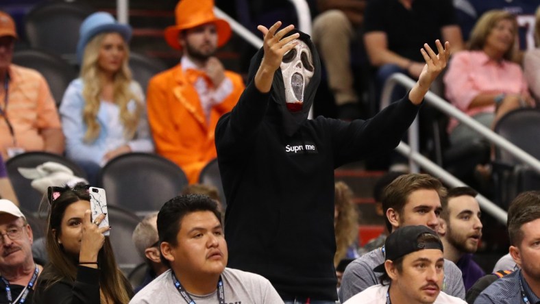 Oct 31, 2018; Phoenix, AZ, USA; A fan dressed up in a Halloween costume mask from the movie Scream reacts in the crowd during the Phoenix Suns game against the San Antonio Spurs at Talking Stick Resort Arena. Mandatory Credit: Mark J. Rebilas-USA TODAY Sports