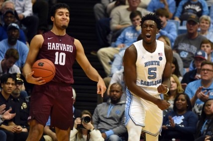 Jan 2, 2019; Chapel Hill, NC, USA; North Carolina Tar Heels forward Nassir Little (5) reacts after drawing an offensive foul from Harvard Crimson guard Noah Kirkwood (10) during the second half at Dean E. Smith Center.  The Tar Heels won 77-57.  Mandatory Credit: Rob Kinnan-USA TODAY Sports