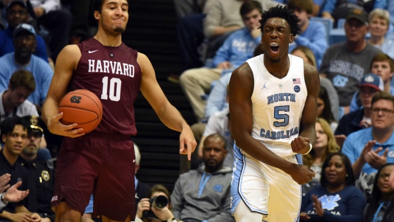 Jan 2, 2019; Chapel Hill, NC, USA; North Carolina Tar Heels forward Nassir Little (5) reacts after drawing an offensive foul from Harvard Crimson guard Noah Kirkwood (10) during the second half at Dean E. Smith Center.  The Tar Heels won 77-57.  Mandatory Credit: Rob Kinnan-USA TODAY Sports