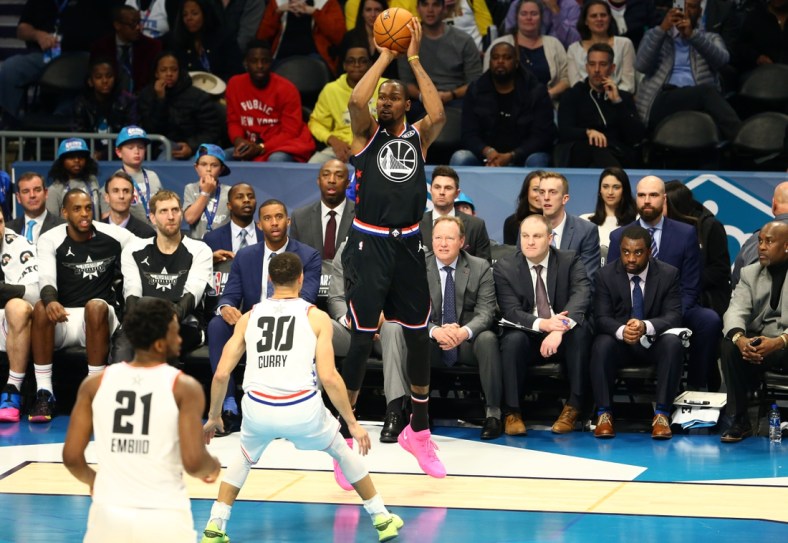 Feb 17, 2019; Charlotte, NC, USA; Team Lebron forward Kevin Durant of the Golden State Warrior (35) shoots a 3-point shot over Team Giannis guard Stephen Curry of the Golden State Warriors (30) during the All Star Game at Spectrum Center. Mandatory Credit: Jeremy Brevard-USA TODAY Sports
