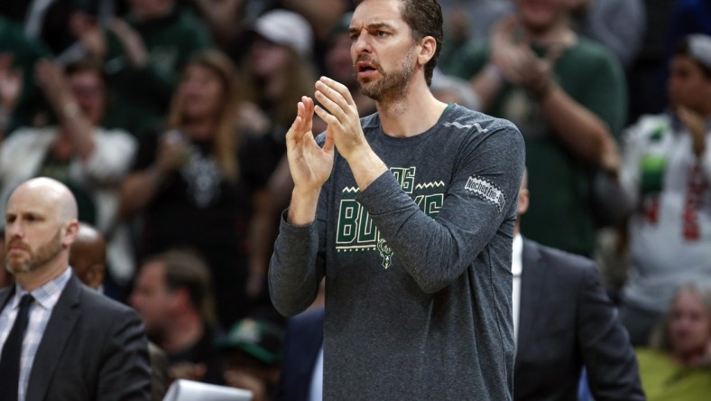 Mar 9, 2019; Milwaukee, WI, USA; Milwaukee Bucks center Pau Gasol (17) applauds his team against the Charlotte Hornets during the first half at Wisconsin Entertainment and Sports Center. Mandatory Credit: Kamil Krzaczynski-USA TODAY Sports