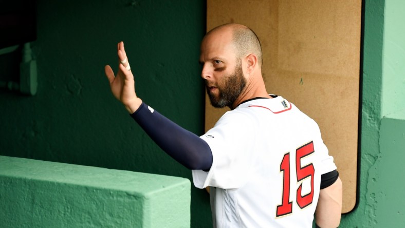 Apr 9, 2019; Boston, MA, USA; Boston Red Sox second baseman Dustin Pedroia waves to fans after batting practice before a game against the Toronto Blue Jays at Fenway Park. Mandatory Credit: Brian Fluharty-USA TODAY Sports