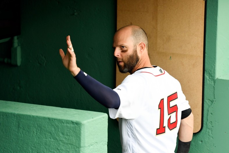 Apr 9, 2019; Boston, MA, USA; Boston Red Sox second baseman Dustin Pedroia waves to fans after batting practice before a game against the Toronto Blue Jays at Fenway Park. Mandatory Credit: Brian Fluharty-USA TODAY Sports