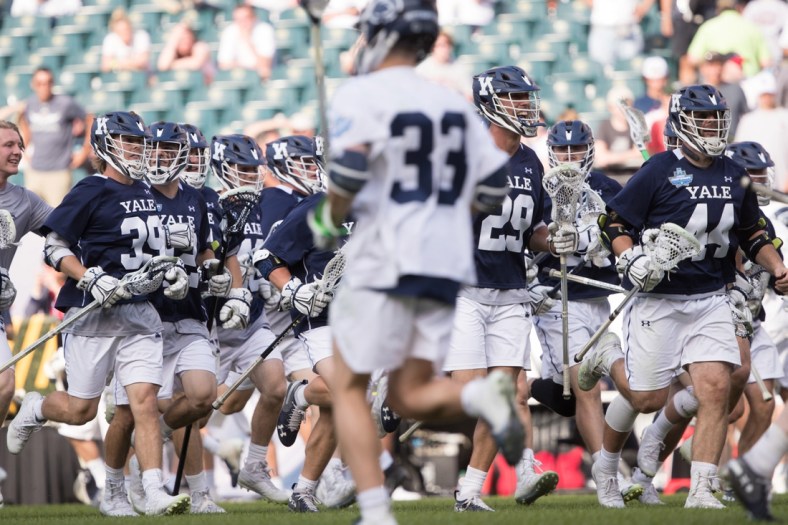 May 25, 2019; Philadelphia, PA, USA; The Yale Bulldogs rush the field after a victory against the Penn State Nittany Lions in the semifinals of the men's NCAA lacrosse national championship at Lincoln Financial Field. Mandatory Credit: Bill Streicher-USA TODAY Sports