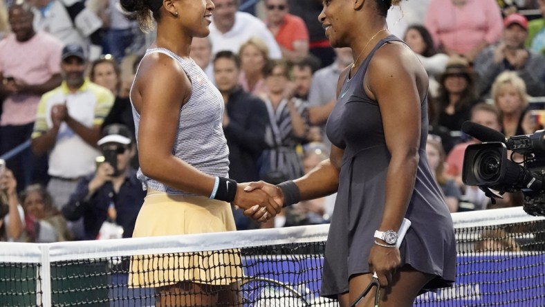 Aug 9, 2019; Toronto, Ontario, Canada; Naomi Osaka (left) congratulates Serena Williams (right) on her win during the Rogers Cup tennis tournament at Aviva Centre. Mandatory Credit: John E. Sokolowski-USA TODAY Sports