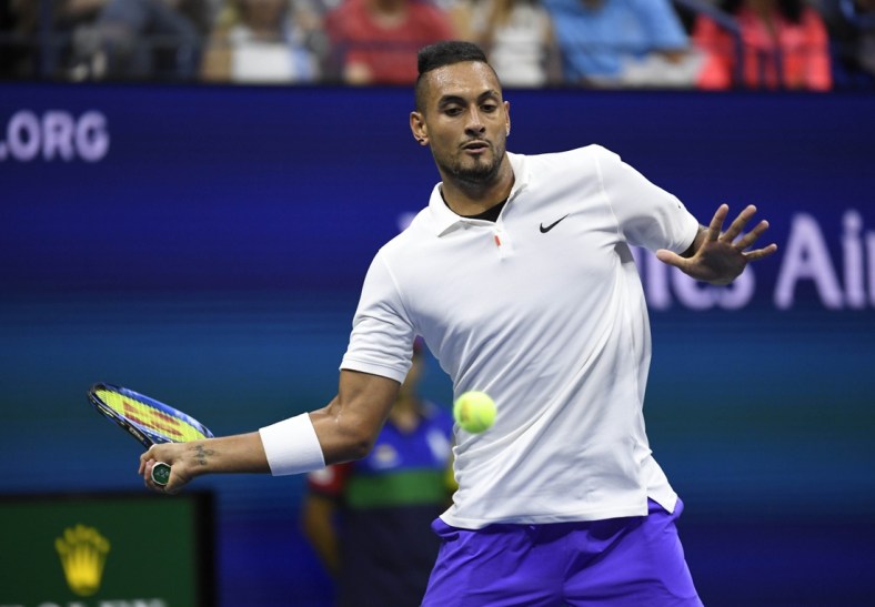 Aug 31, 2019; Flushing, NY, USA; Nick Kyrgios of Australia returns a shot against Andrey Rublev of Russia in a third round match on day six of the 2019 U.S. Open tennis tournament at USTA Billie Jean King National Tennis Center. Mandatory Credit: Danielle Parhizkaran-USA TODAY Sports