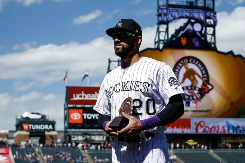 Sep 18, 2019; Denver, CO, USA; Colorado Rockies left fielder Ian Desmond (20) accepts the Roberto Clemente Award before a game against the New York Mets at Coors Field. Mandatory Credit: Isaiah J. Downing-USA TODAY Sports