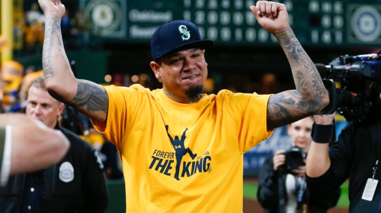 Sep 26, 2019; Seattle, WA, USA; Starting pitcher Felix Hernandez (34) celebrates with fans following a 3-1 loss against the Oakland Athletics at T-Mobile Park. Mandatory Credit: Joe Nicholson-USA TODAY Sports