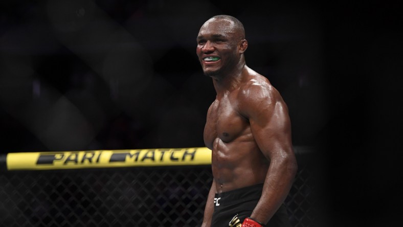 Dec 14, 2019; Las Vegas, NV, USA; Kamaru Usman (red gloves) reacts after defeating Colby Covington (not pictured) during UFC 245 at T-Mobile Arena. Mandatory Credit: Stephen R. Sylvanie-USA TODAY Sports