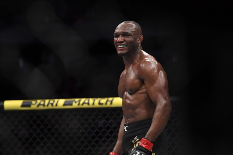 Dec 14, 2019; Las Vegas, NV, USA; Kamaru Usman (red gloves) reacts after defeating Colby Covington (not pictured) during UFC 245 at T-Mobile Arena. Mandatory Credit: Stephen R. Sylvanie-USA TODAY Sports