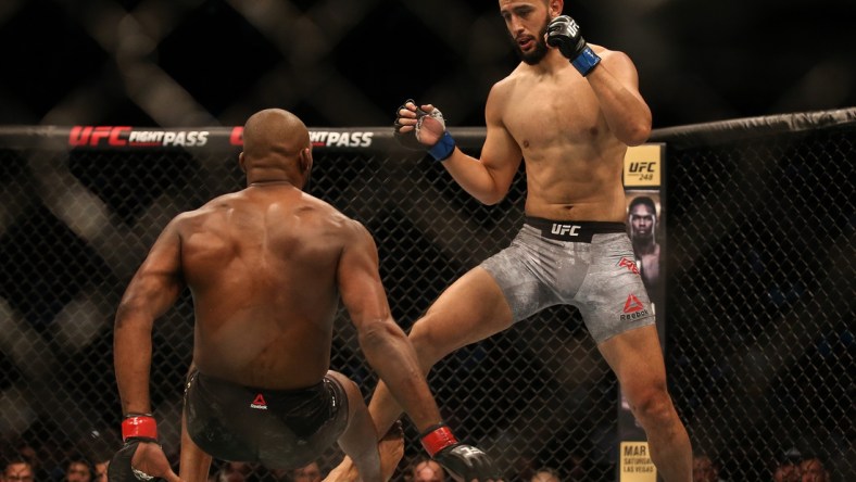 Feb 8, 2020; Houston, Texas, USA;  Jone Jones (red gloves) fights Dominick Reyes (blue gloves) during a UFC championship fight at Toyota Center. Mandatory Credit: Thomas Shea-USA TODAY Sports