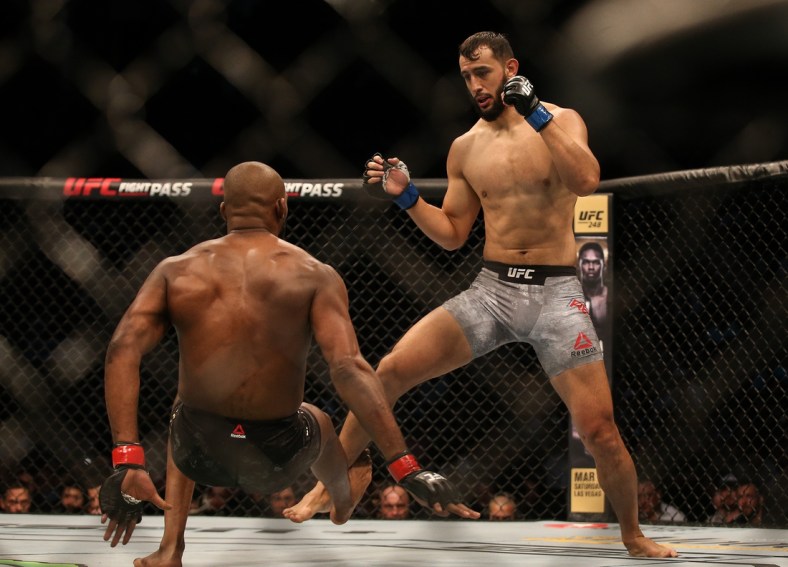 Feb 8, 2020; Houston, Texas, USA;  Jone Jones (red gloves) fights Dominick Reyes (blue gloves) during a UFC championship fight at Toyota Center. Mandatory Credit: Thomas Shea-USA TODAY Sports