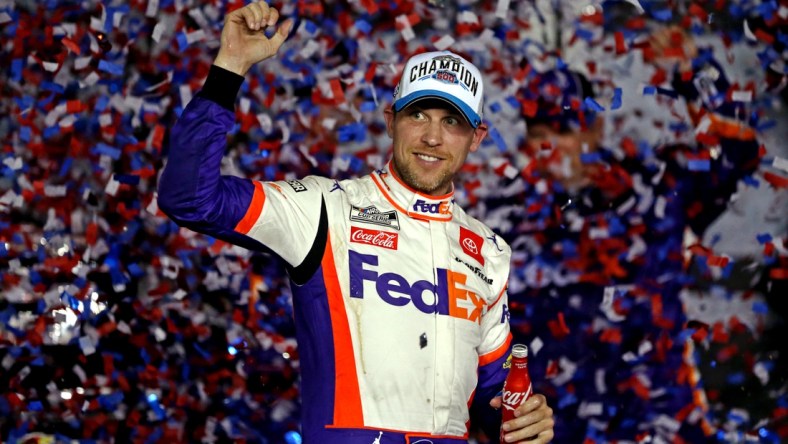 Feb 17, 2020; Daytona Beach, Florida, USA; NASCAR Cup Series driver Denny Hamlin (11) celebrates winning the Daytona 500 at Daytona International Speedway. Mandatory Credit: Peter Casey-USA TODAY Sports