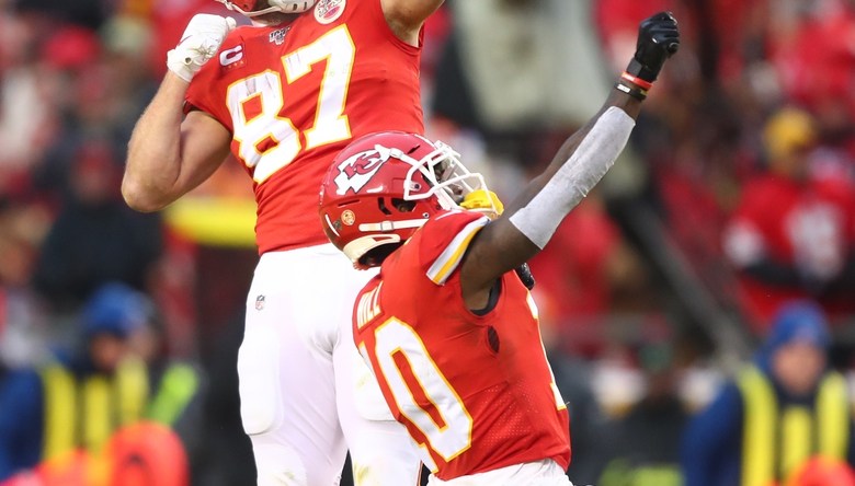 Jan 12, 2020; Kansas City, Missouri, USA; Kansas City Chiefs tight end Travis Kelce (87) celebrates with wide receiver Tyreek Hill (10) against the Houston Texans in the AFC Divisional Round playoff football game at Arrowhead Stadium. Mandatory Credit: Mark J. Rebilas-USA TODAY Sports