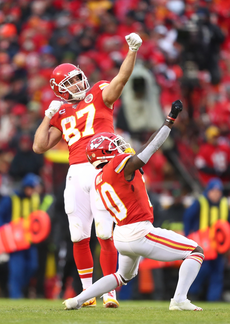 Jan 12, 2020; Kansas City, Missouri, USA; Kansas City Chiefs tight end Travis Kelce (87) celebrates with wide receiver Tyreek Hill (10) against the Houston Texans in the AFC Divisional Round playoff football game at Arrowhead Stadium. Mandatory Credit: Mark J. Rebilas-USA TODAY Sports