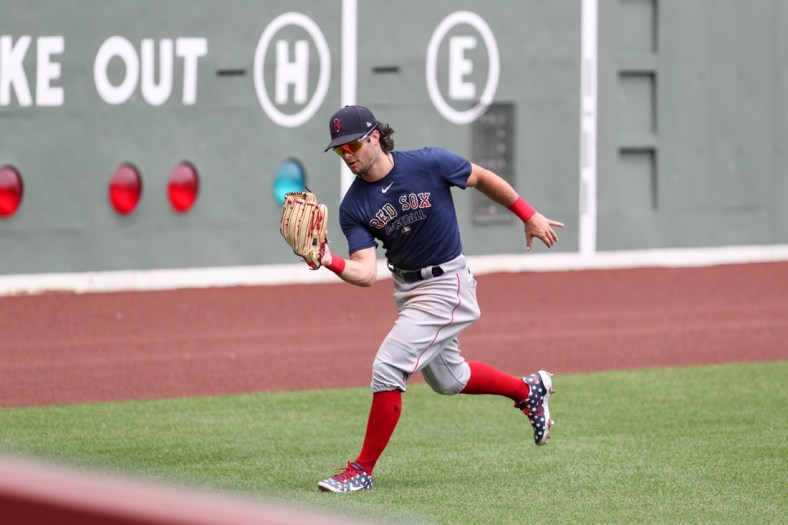 July 10, 2020; Boston, Massachusetts, United States; Boston Red Sox left fielder Andrew Benintendi (16) makes a catch during summer camp practices at Fenway Park. Mandatory Credit: Paul Rutherford-USA TODAY Sports