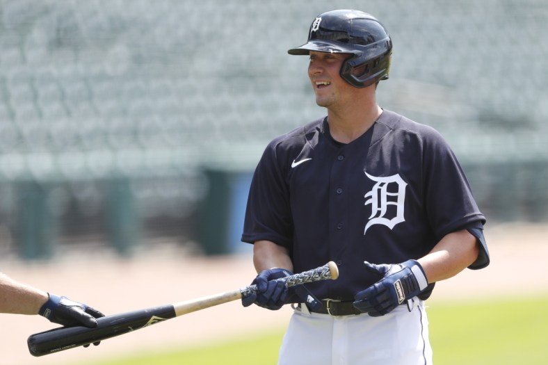 Jul 10, 2020; Detroit, Michigan, United States; Detroit Tigers infielder Spencer Torkelson (73) smiles as he gets his bat handed to him during a summer camp intrasquad game at Comerica Park. Mandatory Credit: Raj Mehta-USA TODAY Sports