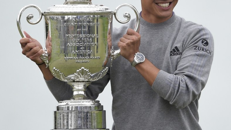 Aug 9, 2020; San Francisco, California, USA; Collin Morikawa poses with the Wanamaker Trophy after winning the 2020 PGA Championship golf tournament at TPC Harding Park. Mandatory Credit: Kelvin Kuo-USA TODAY Sports