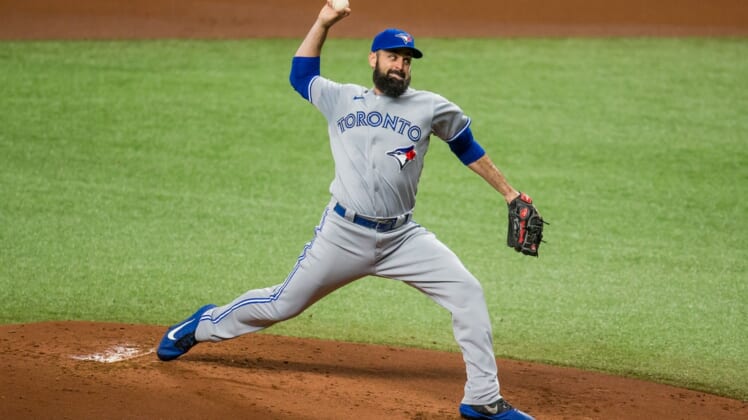 Aug 21, 2020; St. Petersburg, Florida, USA;  Toronto Blue Jays starting pitcher Matt Shoemaker (34) delivers a pitch during the first inning of a game against the Tampa Bay Rays at Tropicana Field. Mandatory Credit: Mary Holt-USA TODAY Sports