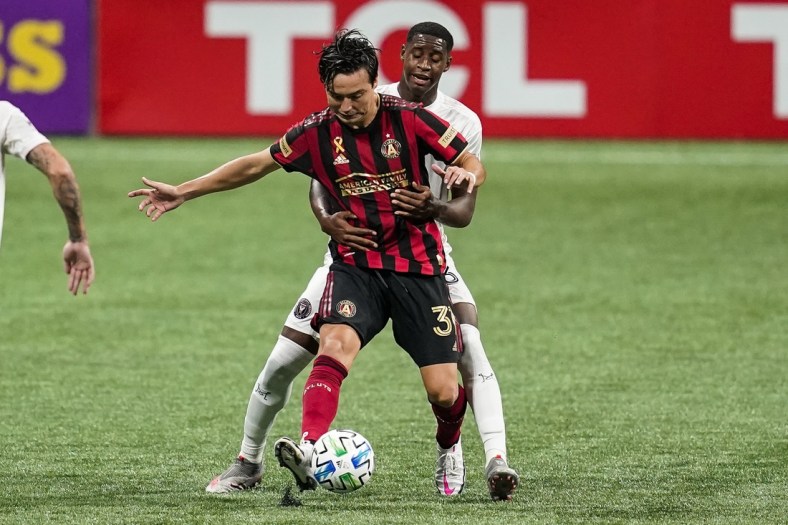Sep 2, 2020; Atlanta, Georgia, USA; Atlanta United forward Erick Torres (31) tries to play the ball defended by Inter Miami defender Andres Reyes (3) during the second half at Mercedes-Benz Stadium. Mandatory Credit: Dale Zanine-USA TODAY Sports